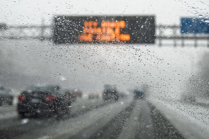 Blurred image of a highway in a snowstorm