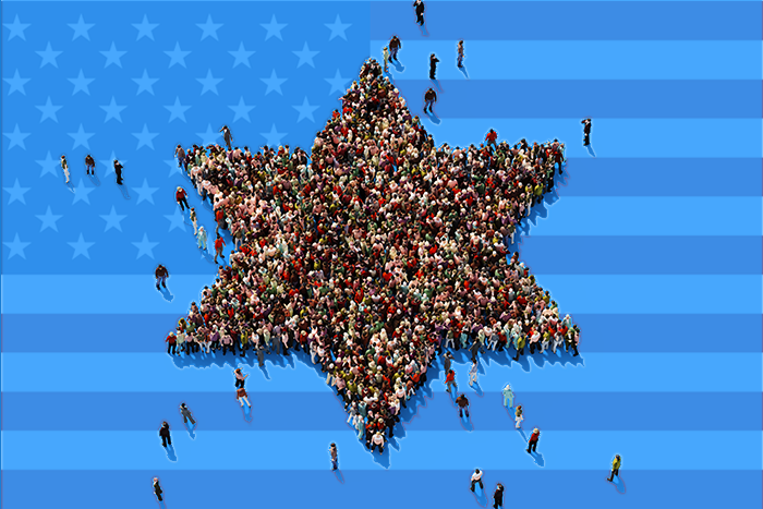 People standing in formation of a Jewish star with US flag in the background