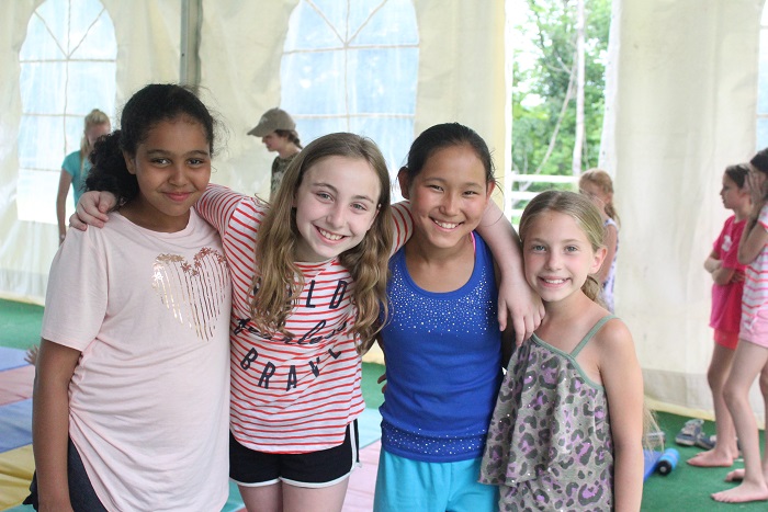 4 female campers at gymnastics 