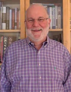 Dr. Steve Weitz in front of bookcase