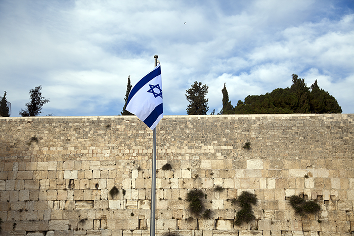 an image of the western wall with an Israeli flag