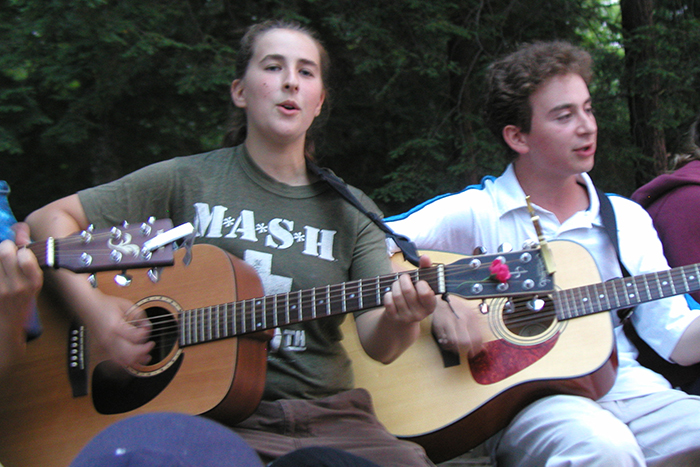Playing guitar at camp