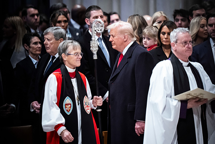 President Donald J Trump, looks at Rev. Mariann Budde as he attends the national prayer service at the Washington National Cathedral on Tuesday, Jan 21, 2025 in Washington, DC.