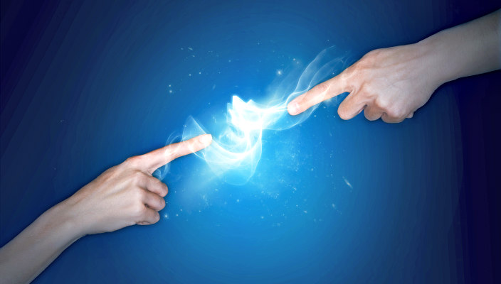 Individuals pointing index fingers at each other with white swirl between them