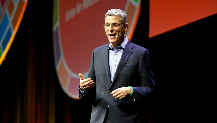 Rabbi Rick Jacobs speaking in front of a blue and white Union for Reform Judaism banner