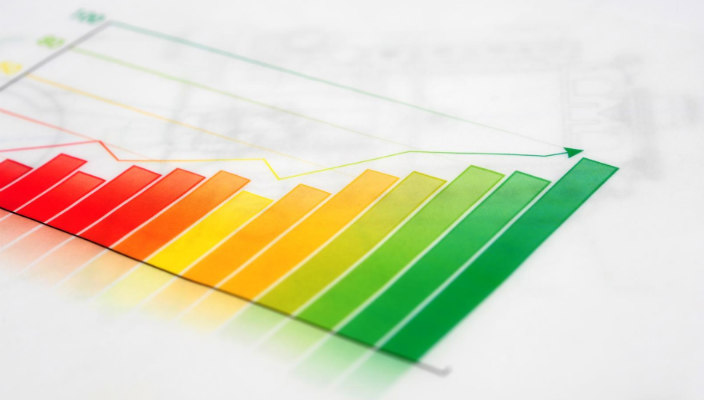 Colorful image of a data growth chart against a white background as if on a desk 