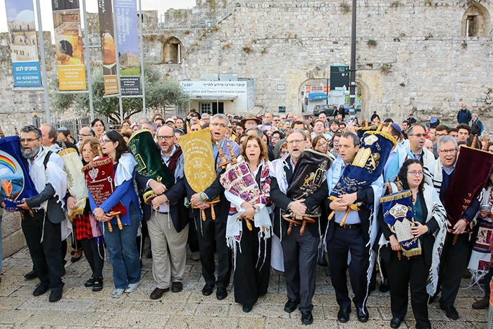 Reform Jewish leaders carrying Torahs at the Kotel in Israel