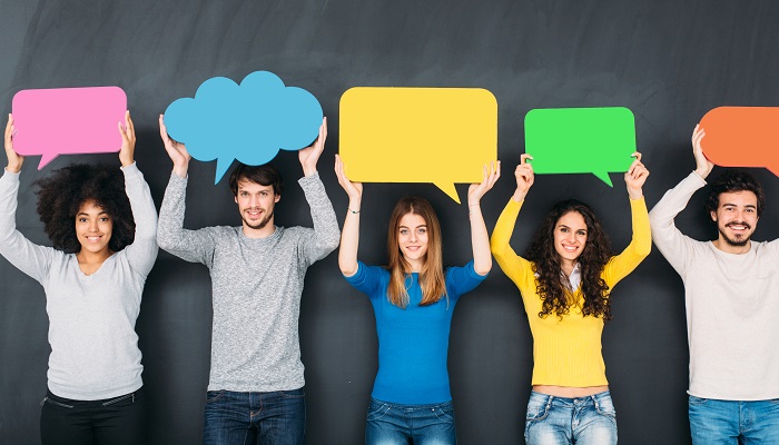 people holding conversation signs