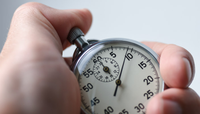 Hand holding a stopwatch