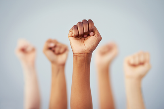 Photo of five fists being held up