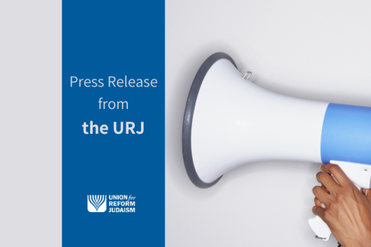 Press release from the URJ - hand holding a megaphone