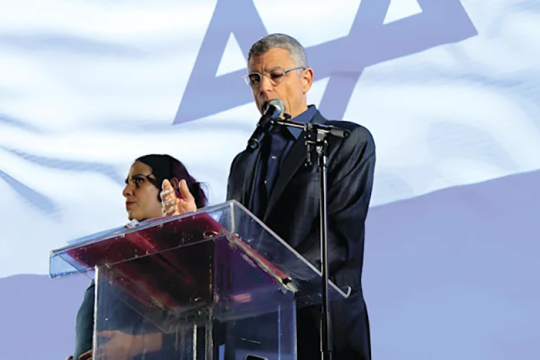 Photo of Rabbi Rick Jacobs standing at a podium speaking