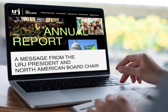 a laptop computer with the URJ 2024 Annual Report on the screen