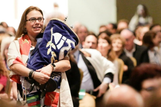 women holding a torah