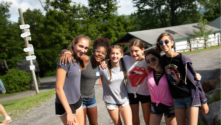 Happy teens posing together at summer camp